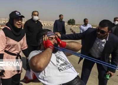 خبرنگاران ثبت رکورد جهانی جابه جایی کامیون با دندان توسط 2 خوزستانی